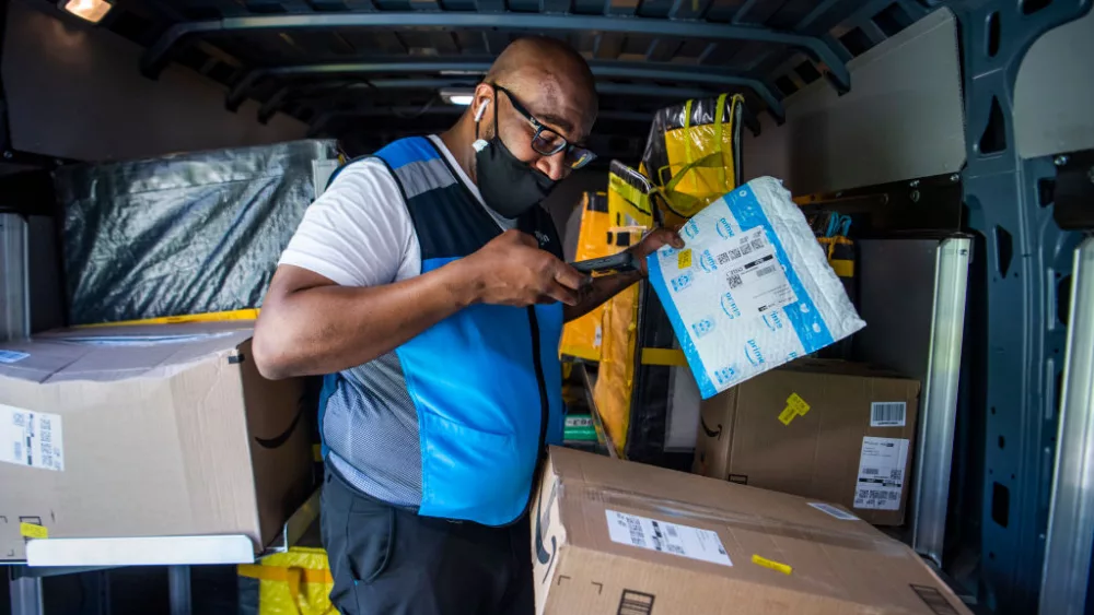 UNITED STATES - APRIL 6: Amazon driver Shawndu Stackhouse delivers packages in Northeast Washington, D.C., on Tuesday, April 6, 2021. (Photo By Tom Williams/CQ-Roll Call, Inc via Getty Images)