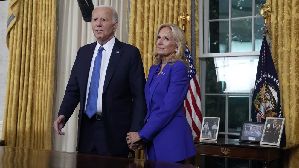 President Joe Biden stands with first lady Jill Biden after addressing the nation from the Oval Office of the White House in Washington, Wednesday, July 24, 2024, about his decision to drop his Democratic presidential reelection bid. (AP Photo/Evan Vucci, Pool)