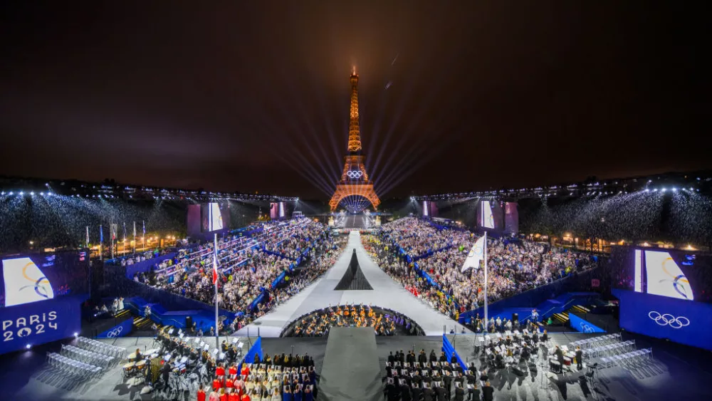 PARIS, FRANCE - JULY 26: The Olympic flag is rasied at the Place du Trocadero in front of the Eiffel Tower during the Opening Ceremony of the Olympic Games Paris 2024 on July 26, 2024 in Paris, France. (Photo by François-Xavier Marit-Pool/Getty Images)
