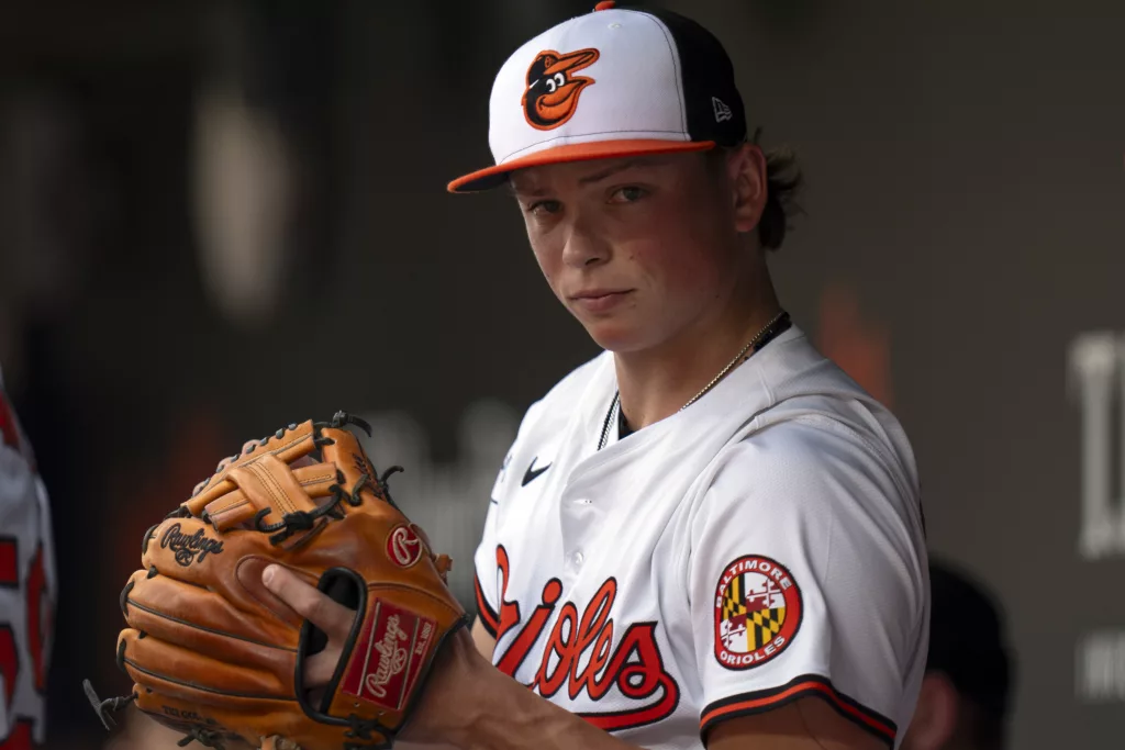 Baltimore Orioles second baseman Jackson Holliday (7) gets ready in the dugout before a baseball game against the Toronto Blue Jays, Wednesday, July 31, 2024, in Baltimore. (AP Photo/Stephanie Scarbrough)