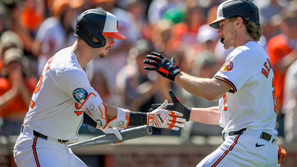 Gunnar Henderson (2) celebrates his solo home run with Baltimore Orioles infielder Ryan O'Hearn (32)