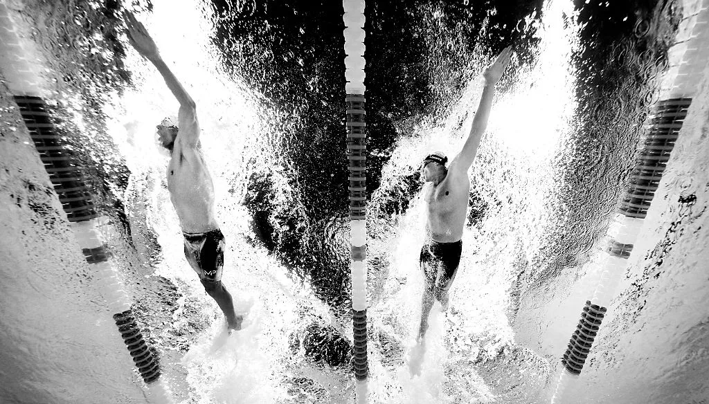 OMAHA, NE - JULY 01: (EDITORS NOTE: This image has been converted to black and white) Michael Phelps (L) and Ryan Lochte (R) of the United States compete in a heat for the Men's 200 Meter Individual Medley during Day Six of the 2016 U.S. Olympic Team Swimming Trials at CenturyLink Center on July 1, 2016 in Omaha, Nebraska. (Photo by Tom Pennington/Getty Images)