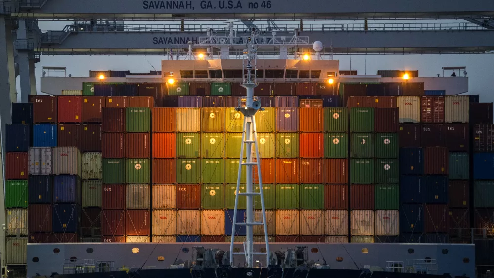 FILE - Ship to shore cranes work the container ship CMA CGM Laperouse at the Georgia Ports Authority's Port of Savannah, Sept. 29, 2021, in Savannah, Ga. (AP Photo/Stephen B. Morton, File)