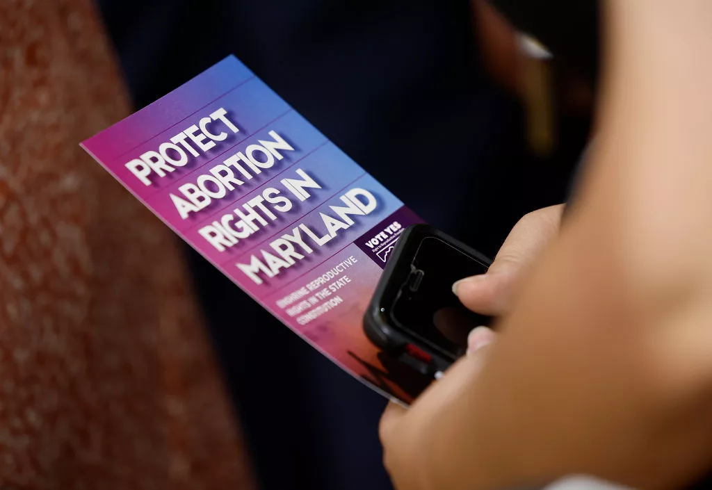 COLLEGE PARK, MARYLAND - JUNE 24: An audience member holds a brochure on abortion rights as Vice President Kamala Harris delivers remarks on reproductive rights at Ritchie Coliseum on the campus of the University of Maryland on June 24, 2024 in College Park, Maryland. Harris is speaking on the two year anniversary of the Dobbs decision, the Supreme Court ruling that overturned Roe v. Wade and struck down federal abortion protections. (Photo by Kevin Dietsch/Getty Images)