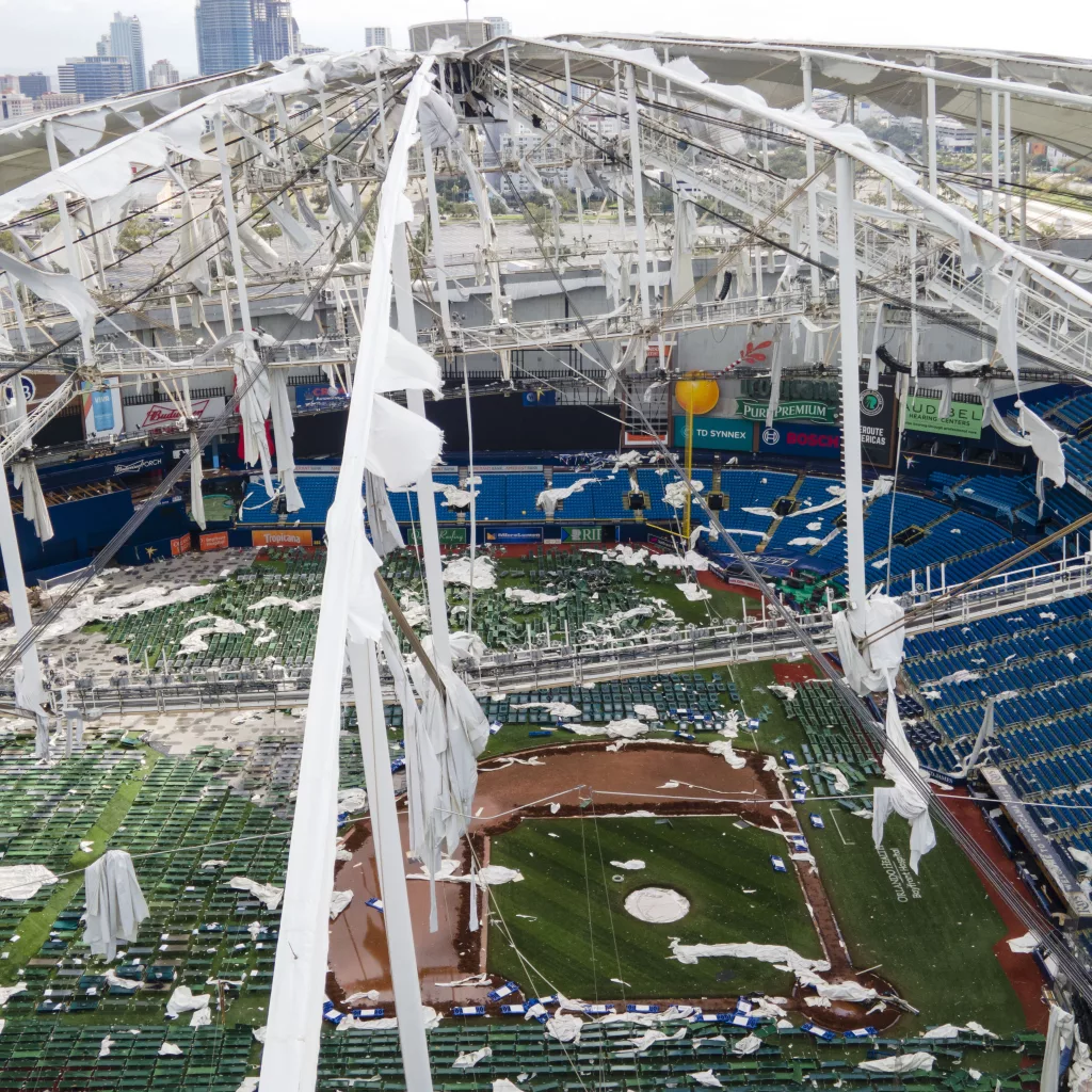 The roof of the Tropicana Field is damaged the morning after Hurricane Milton hit the region, Thursday, Oct. 10, 2024, in St. Petersburg, Fla. (AP Photo/Julio Cortez)