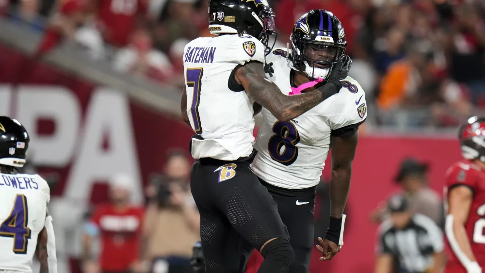 Lamar Jackson threw for 281 yards and five touchdowns, helping the Baltimore Ravens overcome an early double-digit deficit and extend their winning streak to five games with a 41-31 victory Monday night over the Tampa Bay Buccaneers. The Bucs lost their top two receivers, Mike Evans and Chris Godwin, to injuries. Jackson improved to 23-1 against NFC teams, the best mark by a quarterback against an opposing conference in NFL history. He's 3-0 against the Bucs, who faded after taking a 10-0 lead. Godwin suffered an ankle injury that appeared to be severe in the final minutes with the game out of reach.