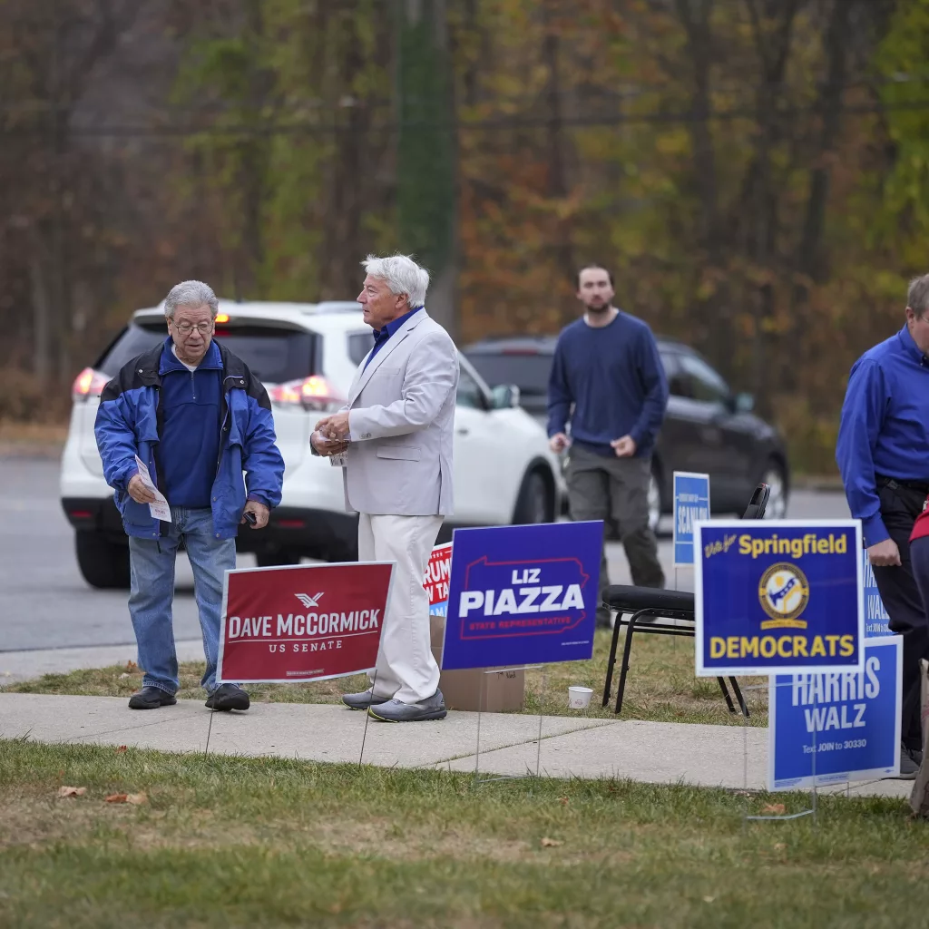 People arrive at polling place to vote, Tuesday, Nov. 5, 2024, in Springfield, Pa. (AP Photo/Matt Slocum)