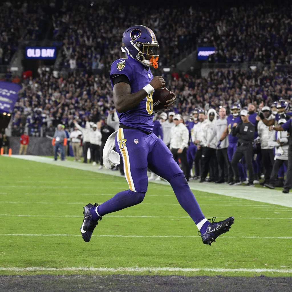 Baltimore Ravens quarterback Lamar Jackson scores a two-point conversion during the second half of an NFL football game against the Cincinnati Bengals, Thursday, Nov. 7, 2024, in Baltimore. (AP Photo/Nick Wass)