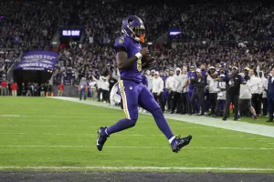 Baltimore Ravens quarterback Lamar Jackson scores a two-point conversion during the second half of an NFL football game against the Cincinnati Bengals, Thursday, Nov. 7, 2024, in Baltimore. (AP Photo/Nick Wass)