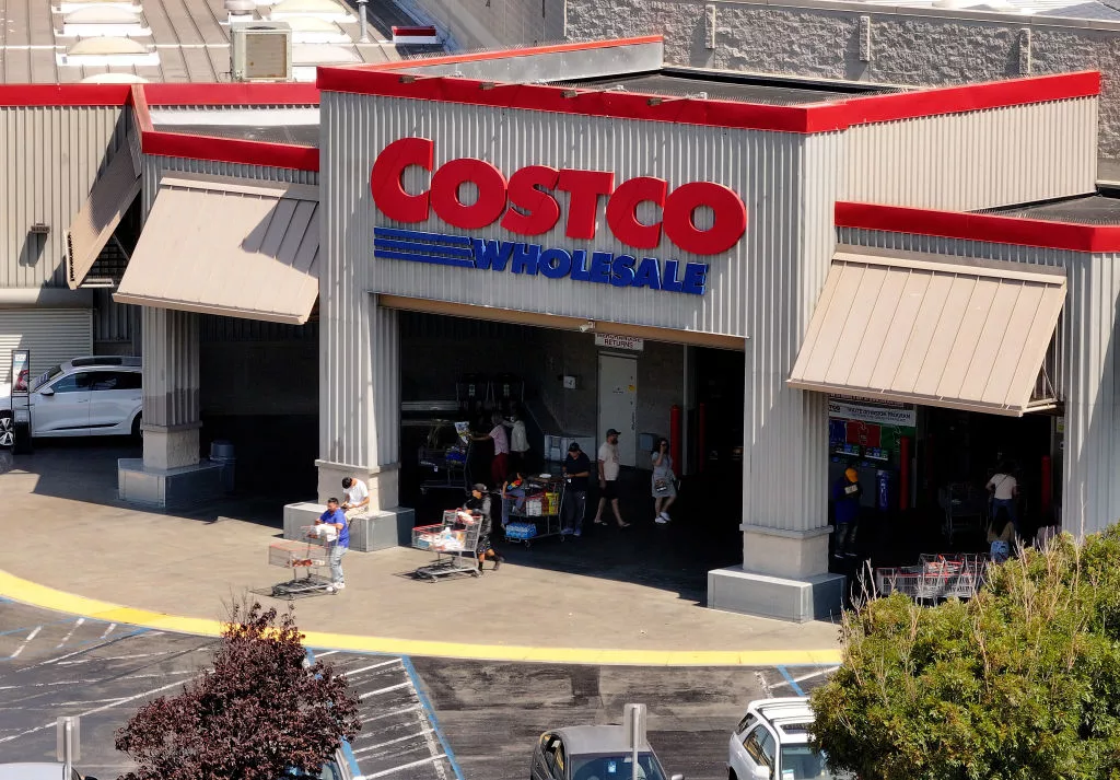 RICHMOND, CALIFORNIA - JULY 11: In an aerial view, the Costco logo is displayed on the exterior of a Costco store on July 11, 2024 in Richmond, California. Costco announced plans to raise membership fees for the first time since 2017 with a $5 jump to $65 a year from $60. (Photo by Justin Sullivan/Getty Images)