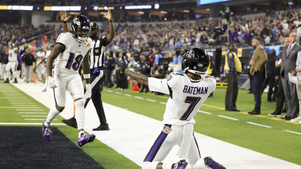 Baltimore Ravens wide receiver Rashod Bateman (7) celebrates his touchdown catch with wide receiver Diontae Johnson (18) during the first half of an NFL football game against the Los Angeles Chargers, Monday, Nov. 25, 2024, in Inglewood, Calif. (AP Photo/Ryan Sun)