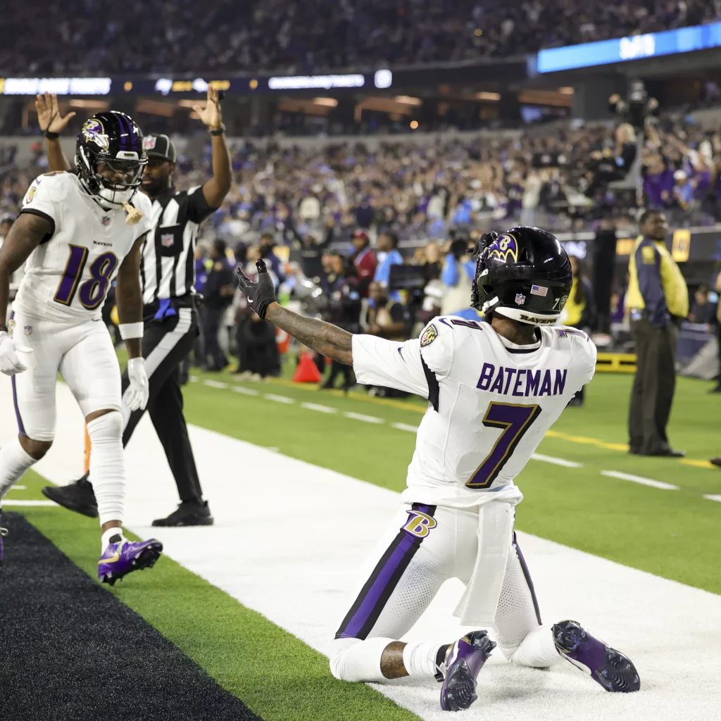 Baltimore Ravens wide receiver Rashod Bateman (7) celebrates his touchdown catch with wide receiver Diontae Johnson (18) during the first half of an NFL football game against the Los Angeles Chargers, Monday, Nov. 25, 2024, in Inglewood, Calif. (AP Photo/Ryan Sun)