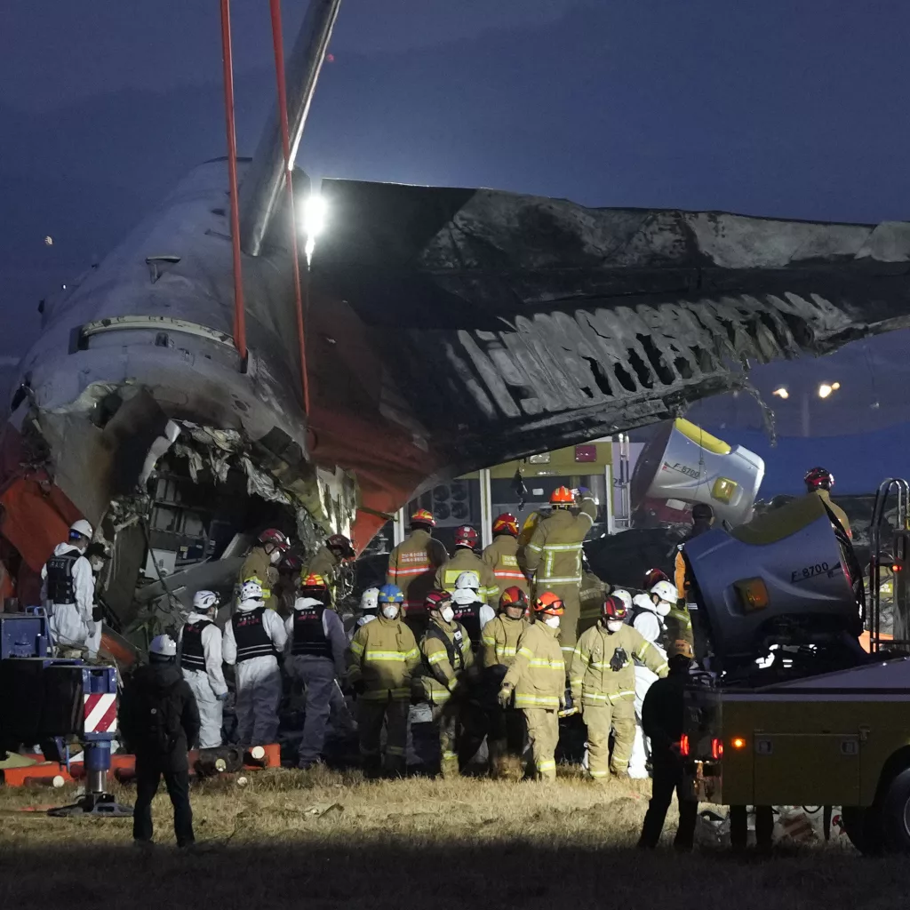 South Korean officials say a passenger plane burst into flames after it skidded off a runway at an airport and slammed into a concrete fence. Its front landing gear had apparently failed to deploy. All but two of the 181 people on board died, making it one of the country’s worst aviation disasters. The accident Sunday morning involved a Jeju Air passenger plane flying from Bangkok to the town of Muan, about 180 miles south of Seoul. The Transport Ministry said the plane was a 15-year-old Boeing 737-800 jet. Footage showed the plane skidding across the airstrip at high speed, apparently with its landing gear still closed, overrunning the runway and colliding head-on with the, triggering an explosion.