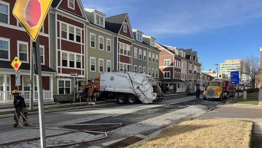 Trash truck crashes into building Monday morning in Towson