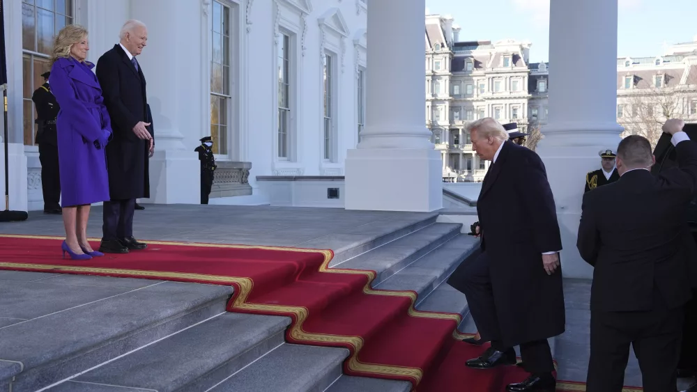 President Joe Biden, center left, and first lady Jill Biden, left, greet President-elect Donald Trump, center right, and Melania Trump, right, upon arriving at the White House, Monday, Jan. 20, 2025, in Washington. (AP Photo/Evan Vucci)