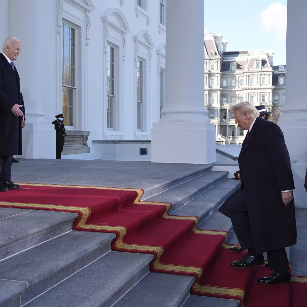 President Joe Biden, center left, and first lady Jill Biden, left, greet President-elect Donald Trump, center right, and Melania Trump, right, upon arriving at the White House, Monday, Jan. 20, 2025, in Washington. (AP Photo/Evan Vucci)