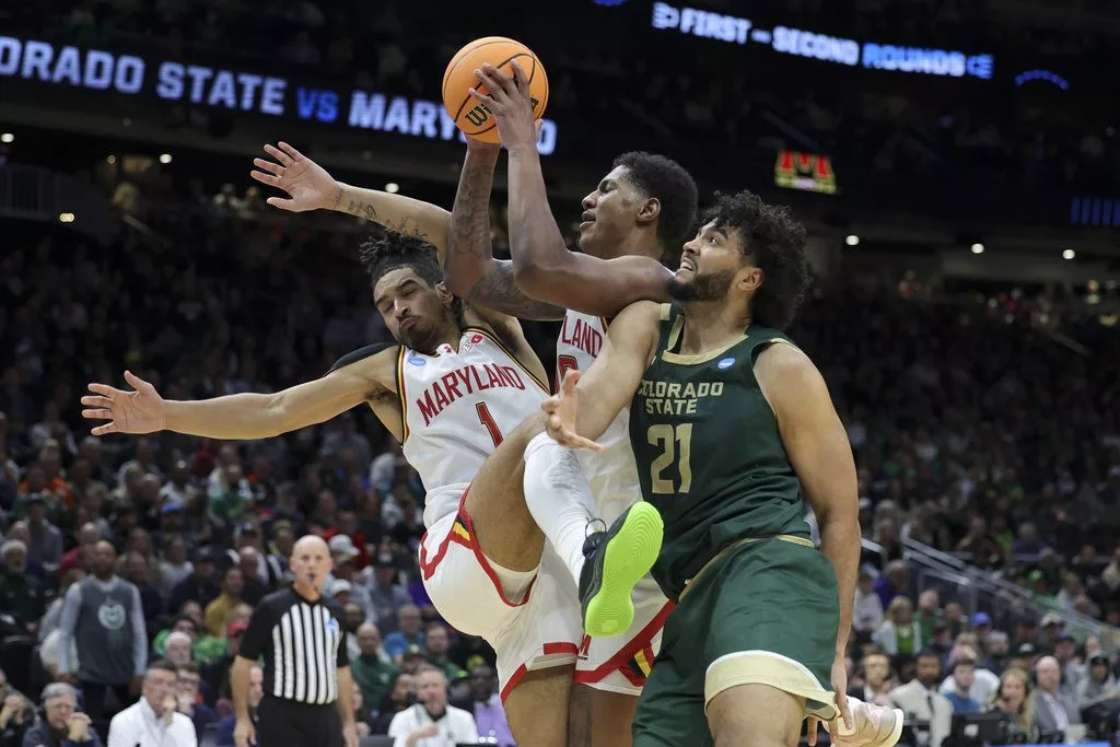 Maryland guard Rodney Rice, left, forward Julian Reese and Colorado State forward Rashaan Mbemba vie for a rebound during the second half in the second round of the NCAA college basketball tournament, Sunday, March 23, 2025, in Seattle. (AP Photo/Ryan Sun)