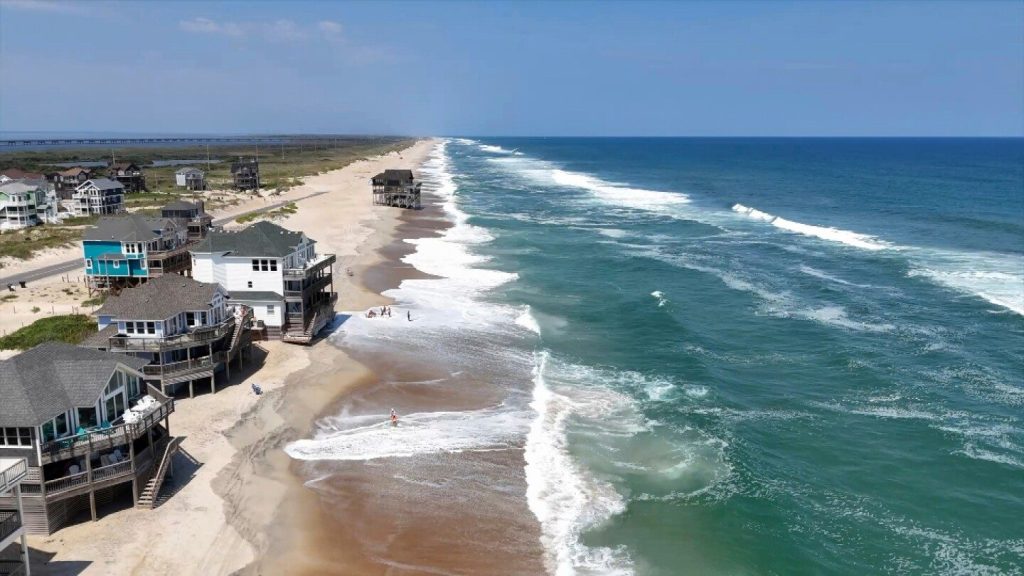 Summer celebrations meet closed beaches and warnings on US East Coast due to Hurricane Erin