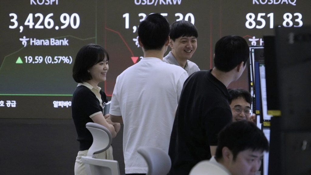 Asian shares mostly rise after Wall Street sets new records
