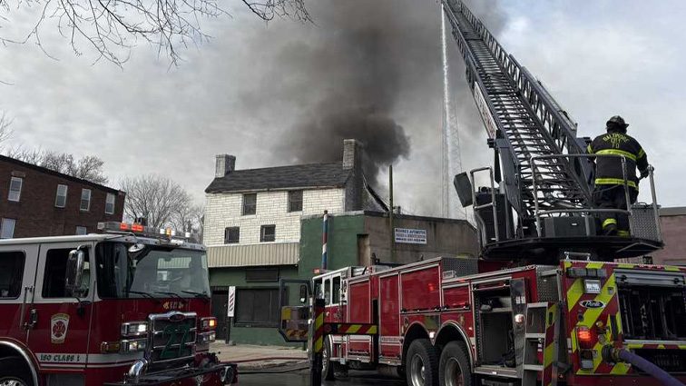 Northeast Baltimore auto shop employee, firefighter injured in 3-alarm fire