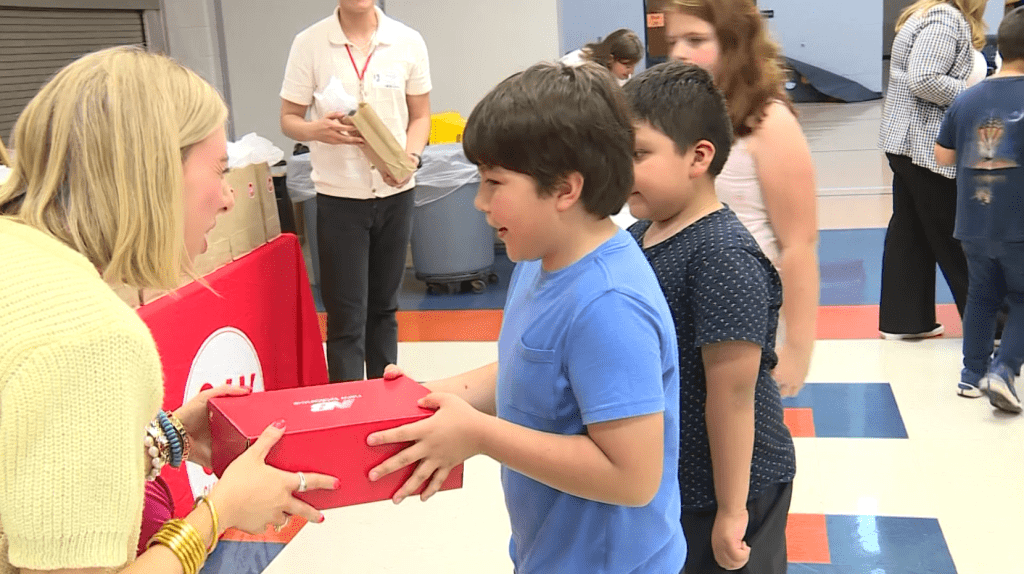 ‘I love them’: Elementary school students receive sneakers for upcoming race