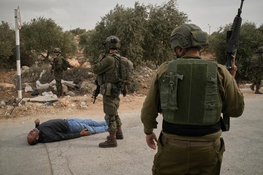 Israel's military says it killed 2 men who had launched an attack in the occupied West Bank