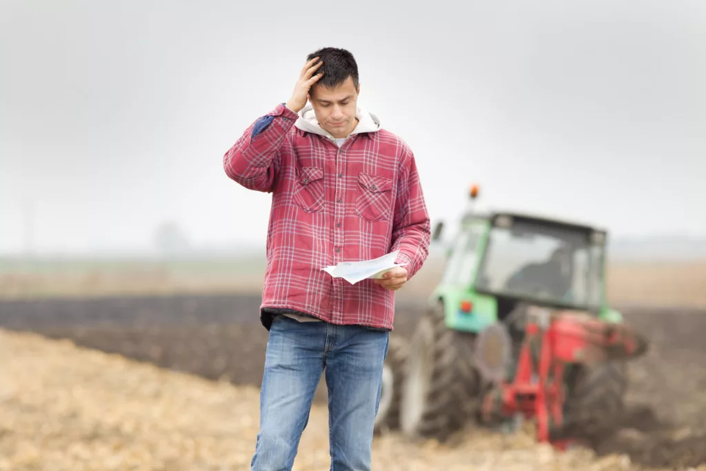 FARMER-IS-WORRIED-ABOUT-FINANCES