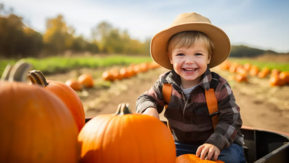happy-smiling-kid-go-pumpkin-picking