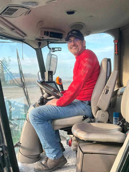 John Schwarz sits in a combine.