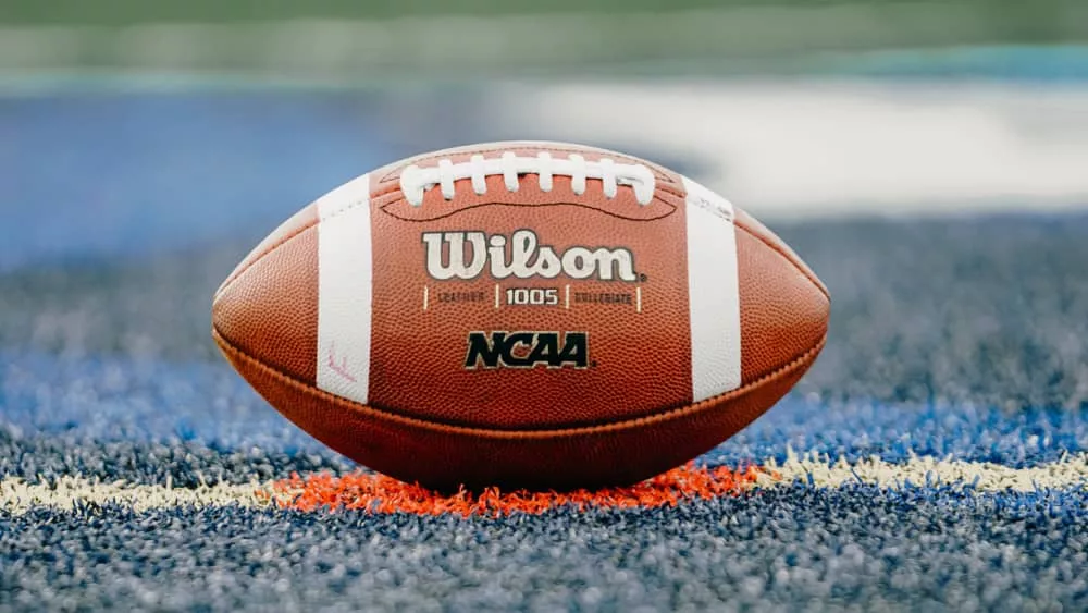 Wilson football ^ NCAA logo on playing field