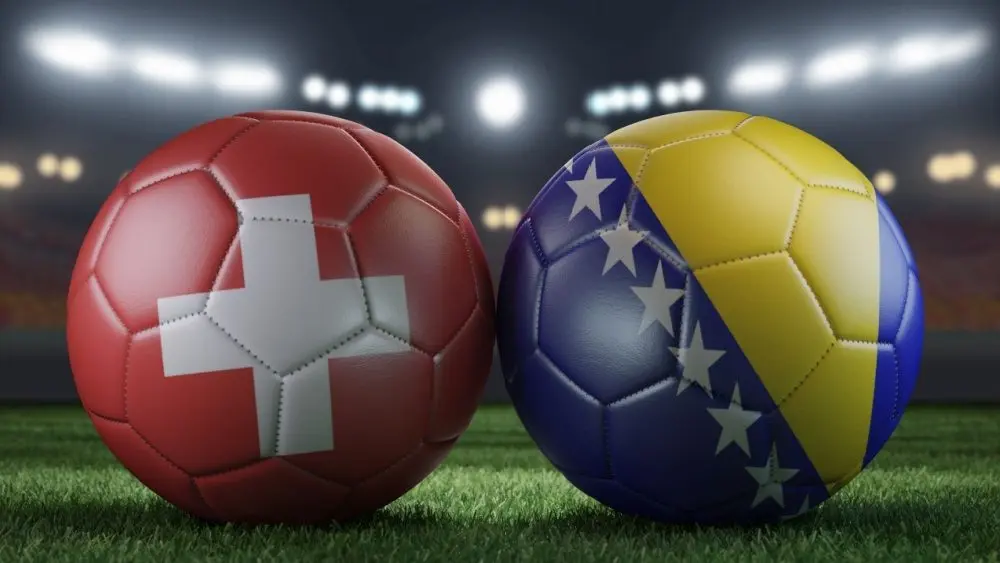 Two shot balls successful flags colors connected a stadium blurred background. Switzerland vs Bosnia and Herzegovina. 3D image.