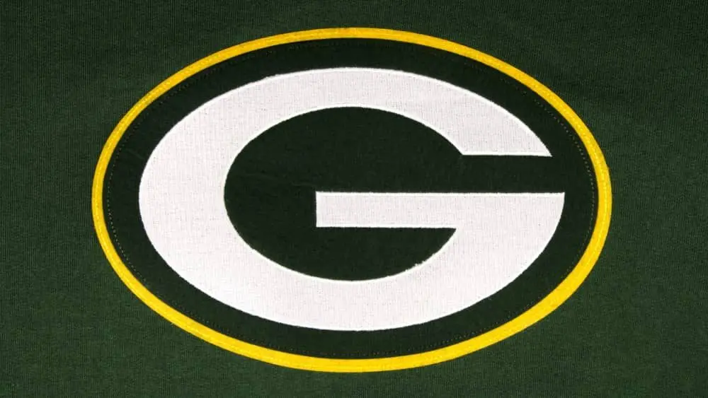 The Green Bay Packers emblem connected greenish background
