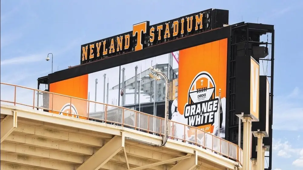 Neyland Stadium is location to the University of Tennessee Volunteer sports teams^ chiefly the shot team. The stadium has a capableness of 101^915 people. Knoxville^ TN^ USA - April 12^ 2025
