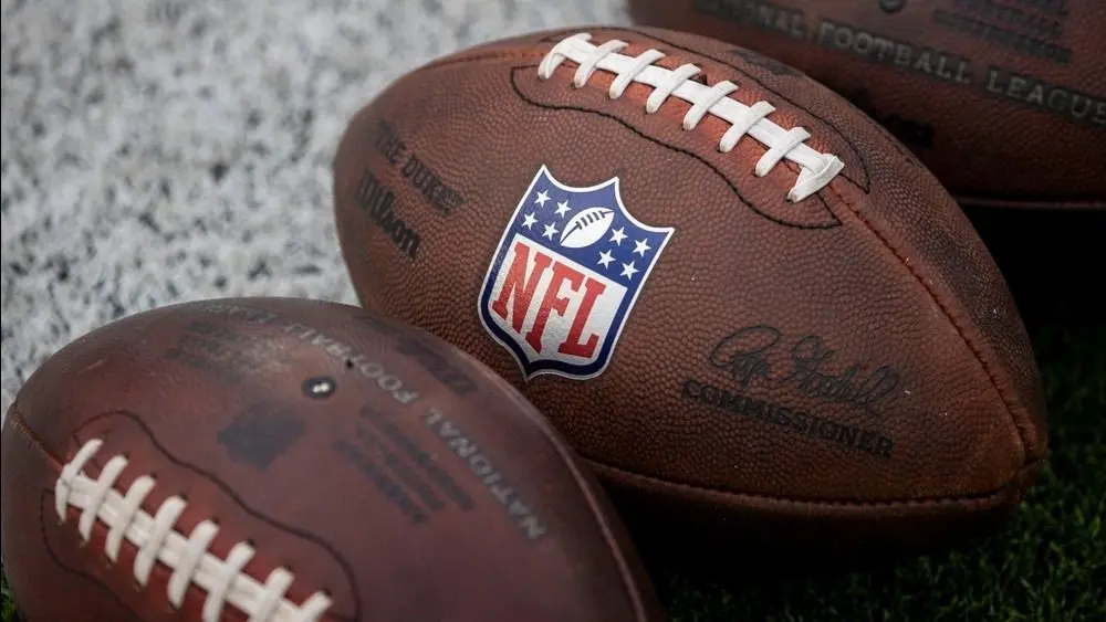 NLF footballs are displayed before an NFL football game between the Los Angeles Rams and the Seattle Seahawks at SoFi Stadium Sunday Nov. 16^ 2025^ in Inglewood^ Calif.