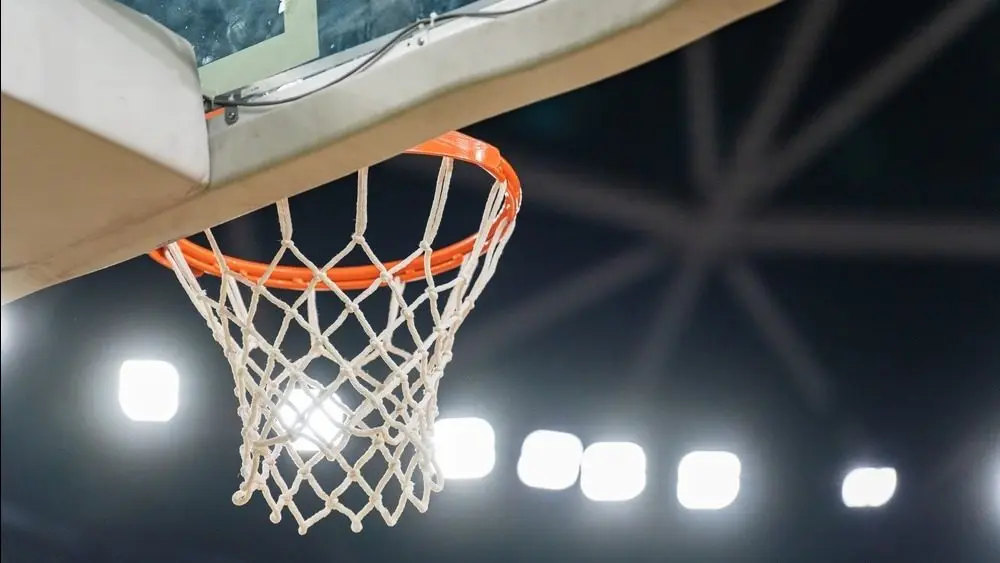 Basketball hoop hanging successful a sports stadium waiting for the ball