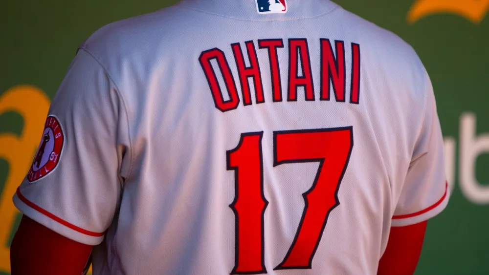 Shohei Ohtani of the Los Angeles Angels in the dugout at the Oakland Coliseum. Oakland^ California - August 10^ 2022