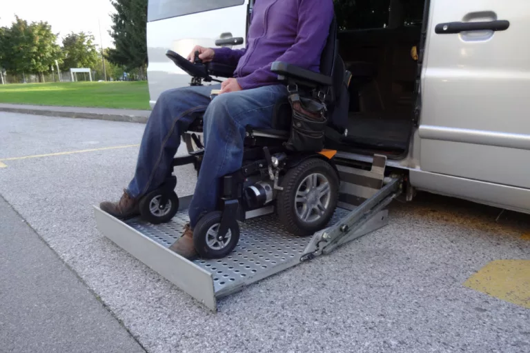 disabledmenonwheelchairusingaccessiblevehiclewithlift