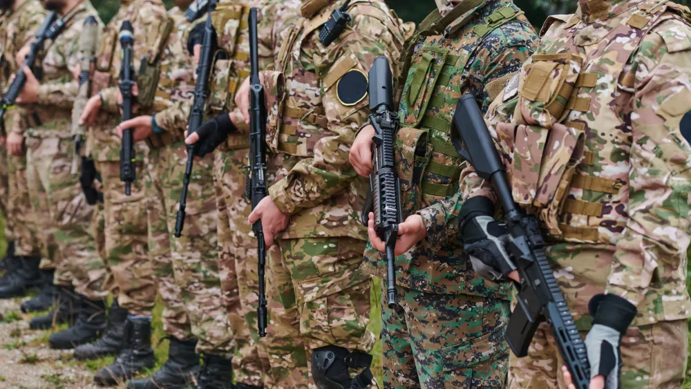 soldier-fighters-standing-together-with-guns-group-portrait-of-us-army-elite-members-private-military-company-servicemen-anti-terrorist-squad