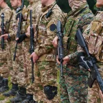 soldier-fighters-standing-together-with-guns-group-portrait-of-us-army-elite-members-private-military-company-servicemen-anti-terrorist-squad