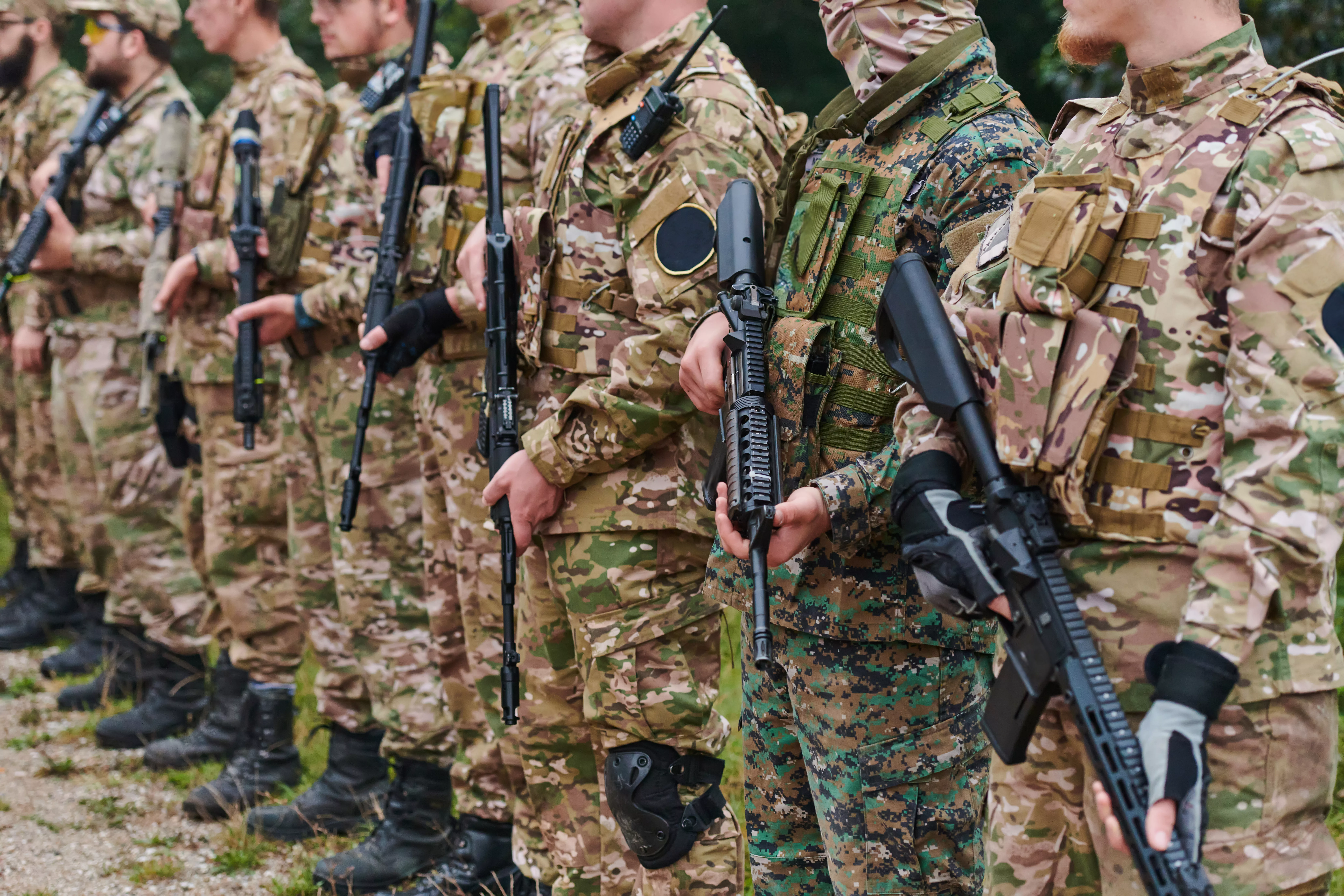 soldier-fighters-standing-together-with-guns-group-portrait-of-us-army-elite-members-private-military-company-servicemen-anti-terrorist-squad