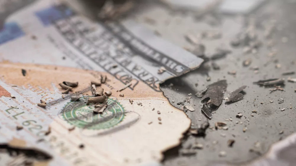 remains-of-burnt-one-hundred-dollar-bills-reduced-to-ashes-symbo