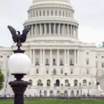 lantern-with-an-eagle-and-blurred-view-of-the-capitol-building-f