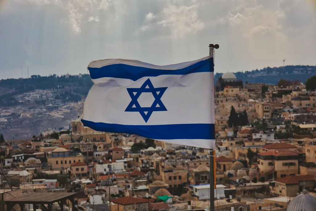 close-up-shot-of-the-flag-of-israel-with-the-old-city-in-background-2