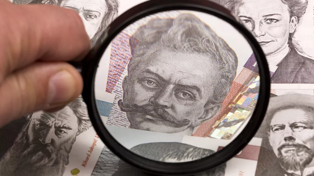slovenian-tolar-in-a-magnifying-glass-2023-11-27-04-55-32-utc
