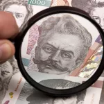 slovenian-tolar-in-a-magnifying-glass-2023-11-27-04-55-32-utc