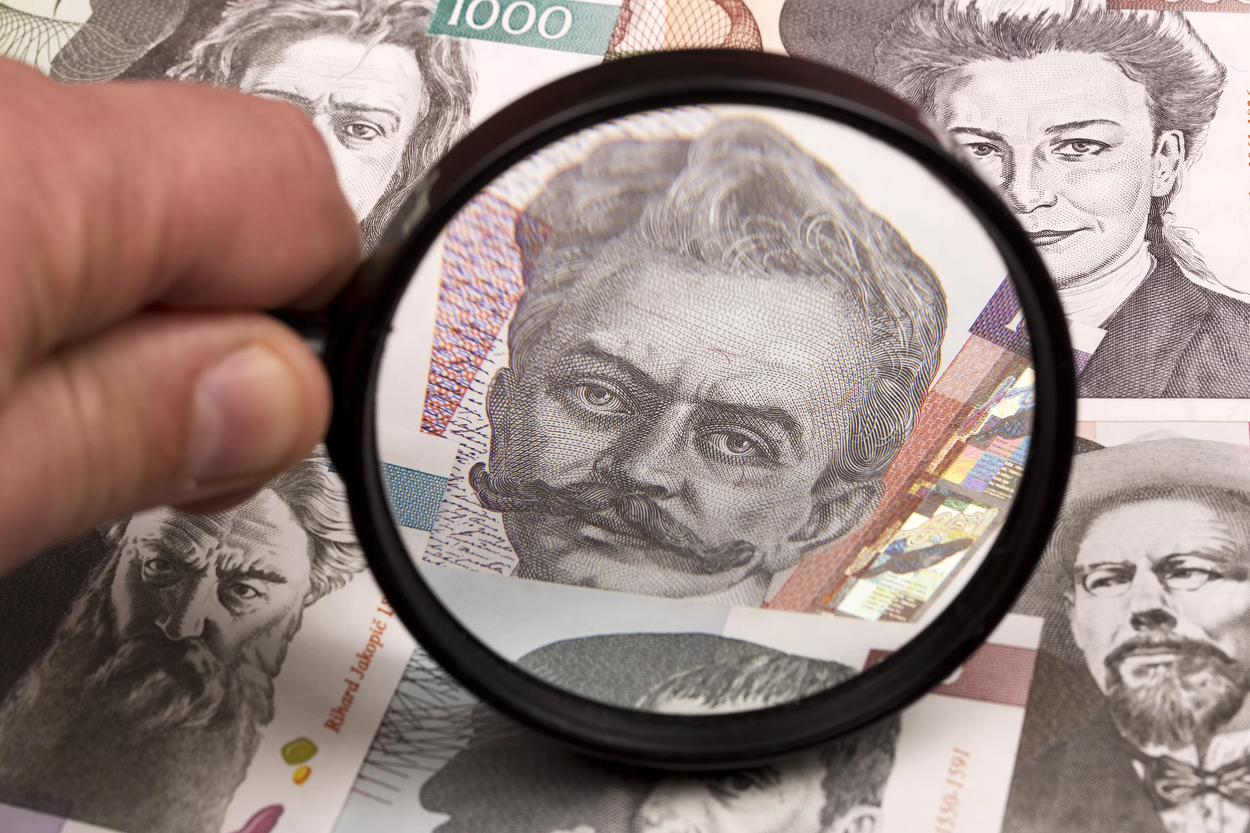 slovenian-tolar-in-a-magnifying-glass-2023-11-27-04-55-32-utc