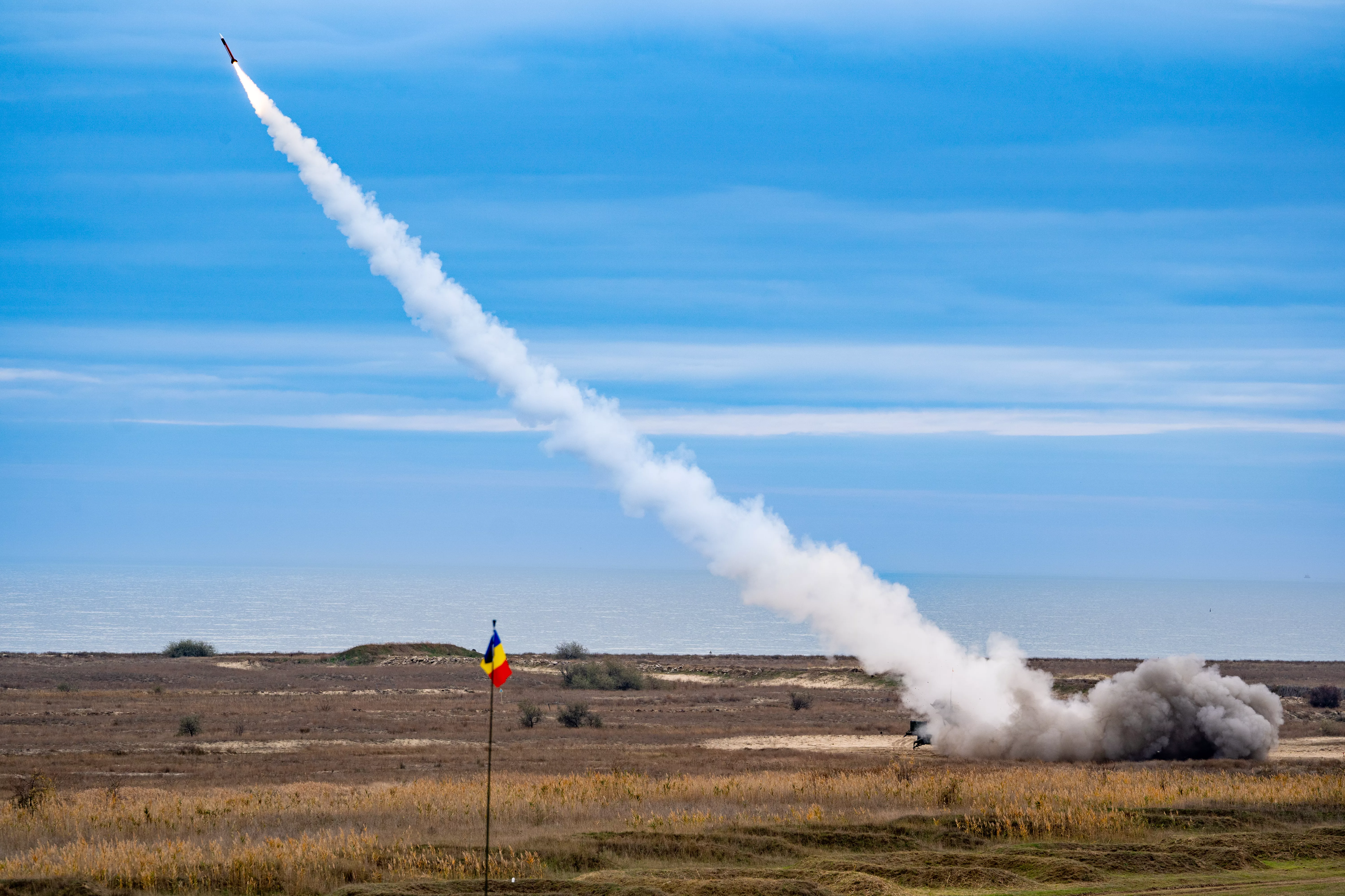 rocket-soaring-in-the-sky-with-a-billowing-cloud-of-smoke-trailing-behind-it