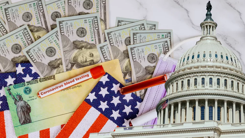 washington-dc-capitol-dome-with-stimulus-financial-a-bill-individual-checks-from-government-us-100-dollar-bills-currency-american-flag-global-pandemic-covid-19-lockdown