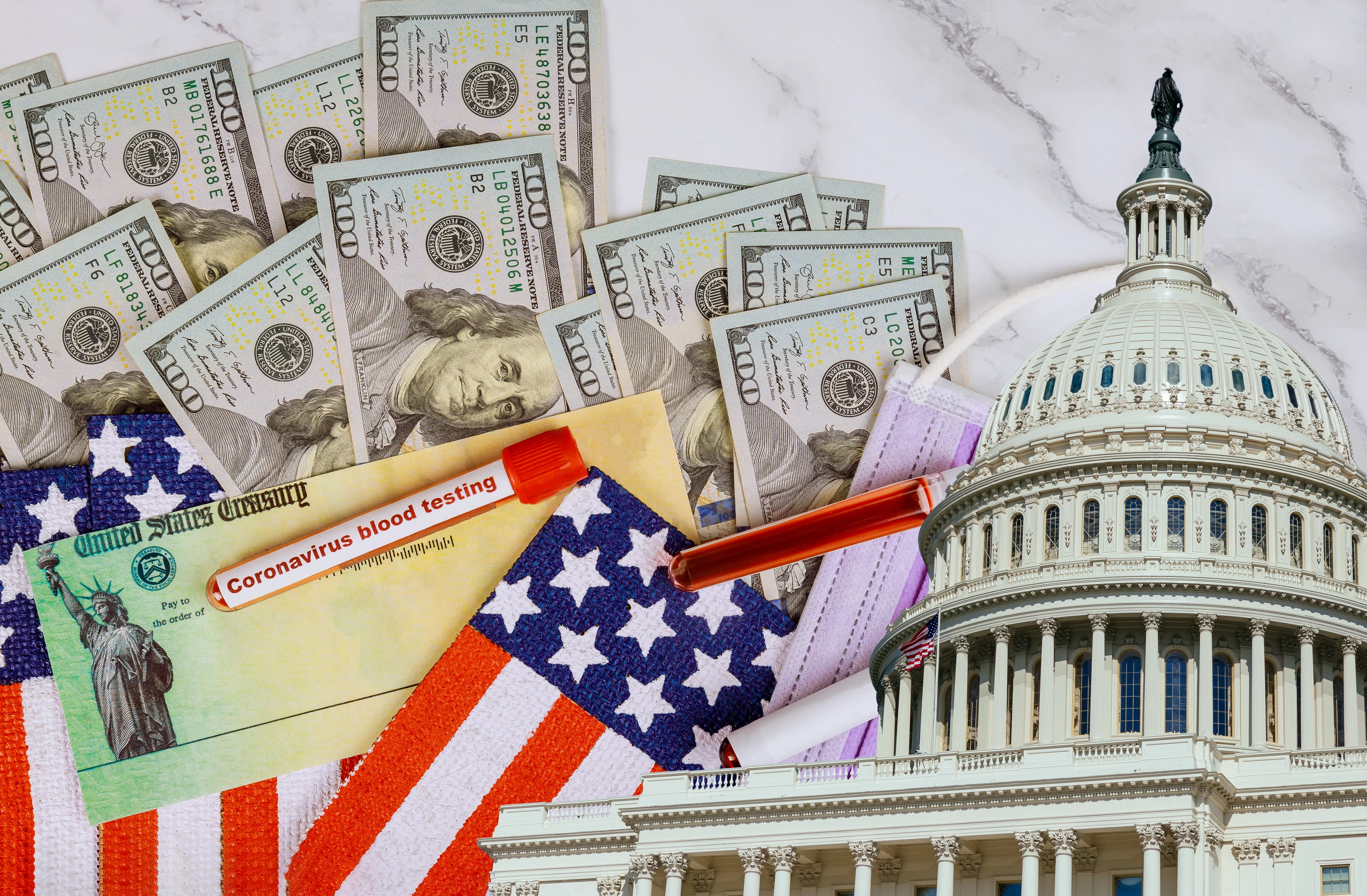 washington-dc-capitol-dome-with-stimulus-financial-a-bill-individual-checks-from-government-us-100-dollar-bills-currency-american-flag-global-pandemic-covid-19-lockdown