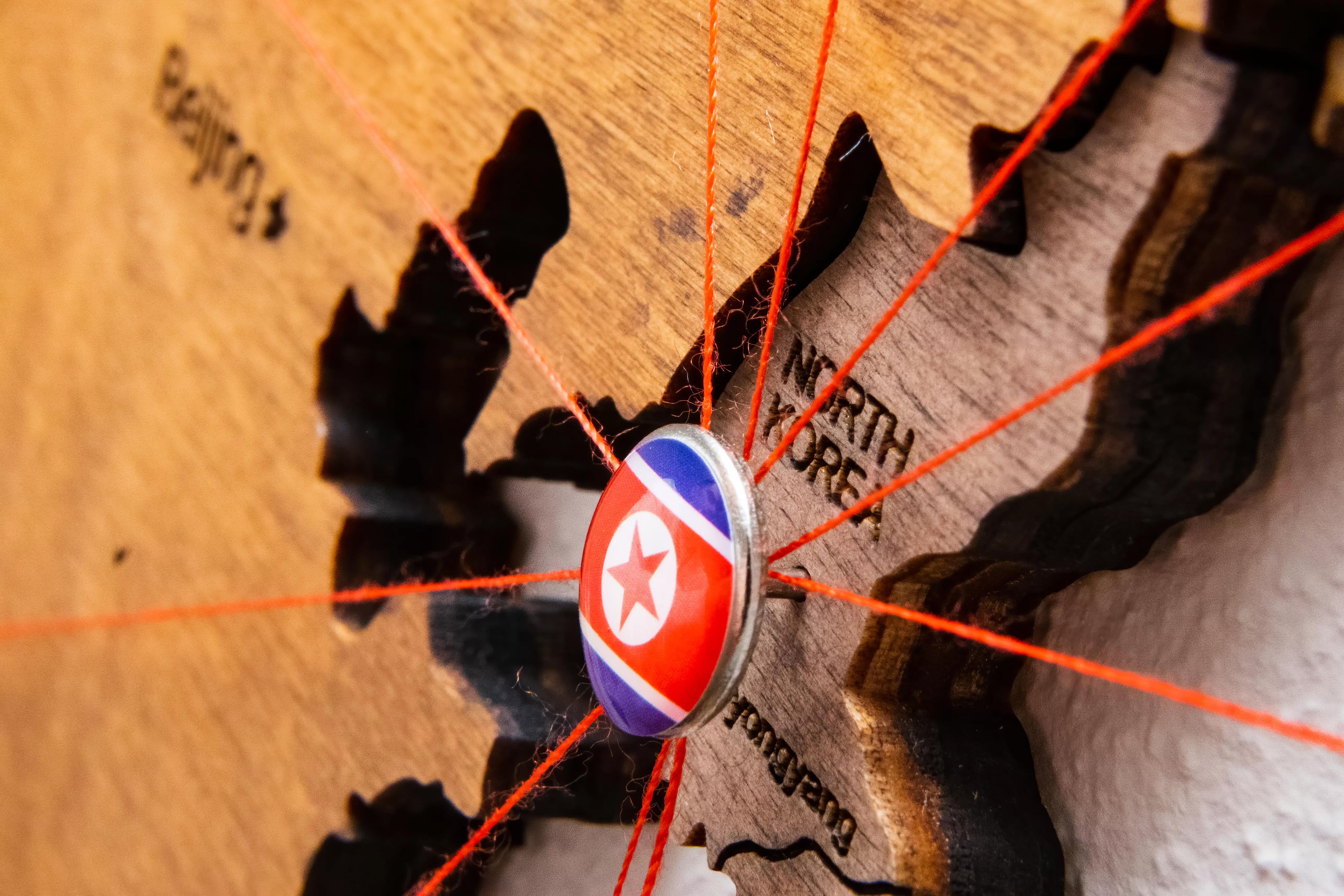 north-korea-flag-pins-and-red-thread-for-traveling-and-planning-trip-2